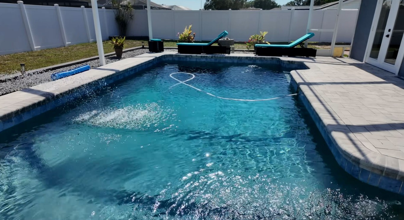 Crystal clear pool water maintained by professional cleaning service in Sanford, FL